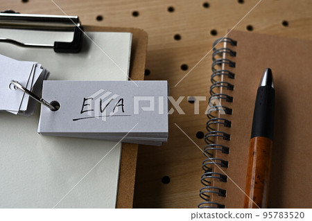 A word book with EVA letters is placed on the clipboard. 95783520