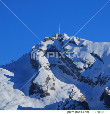 Peak of Mount Saentis in winter. Peak of Mount Saentis in winter. 95784008