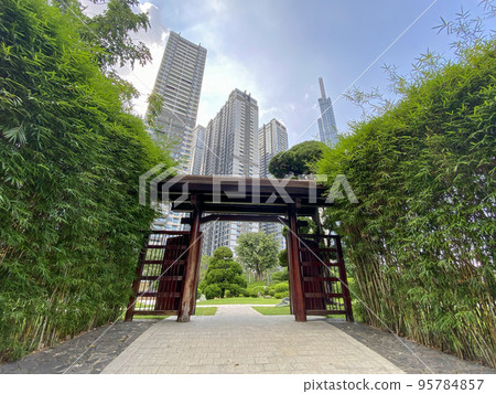 view of wood gate in Vinhome Central Park near Landmark 81 and other high apartment 95784857