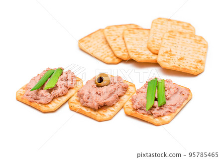 Crispy Salted Crackers with Liver Pate, Green Onions and Olives - Isolated 95785465
