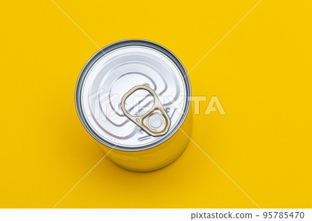 Unopened Tin Can with Blank Edge on Yellow Background 95785470
