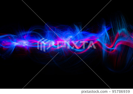 Abstract technology banner design. Long exposure, light painting. Vibrant streaks of digital neon lines on black background. 95786939
