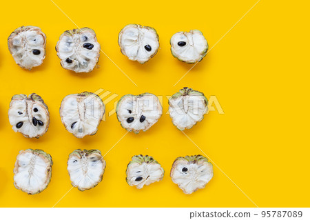 Custard apple on yellow background. Custard apple on yellow background. 95787089