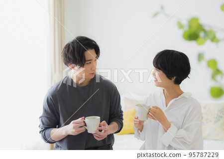 A couple in the living room 95787229