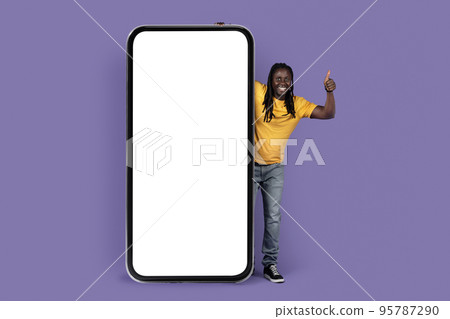 Cool black guy recommending nice mobile app, mockup Cool black guy recommending nice mobile app, mockup 95787290