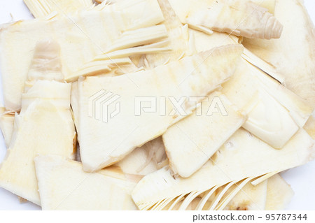 Sliced raw bamboo shoots on white background. Sliced raw bamboo shoots on white background. 95787344
