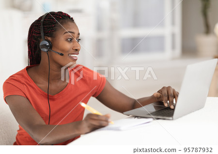 Distance Learning. Black Woman In Headset Study Online With Laptop At Home 95787932