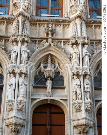Closeup of sculptural details and statues on facade of Leuven Town Hall 95788062