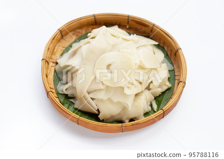 Preserved bamboo shoot slices on white background. Preserved bamboo shoot slices on white background. 95788116
