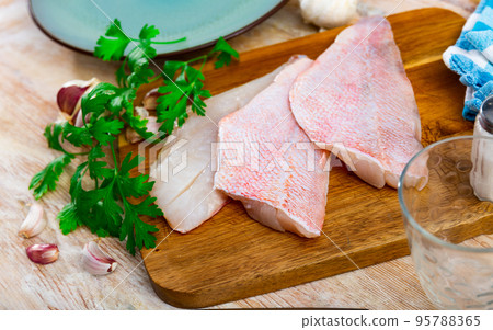 Fresh raw fillet of sea bass 95788365