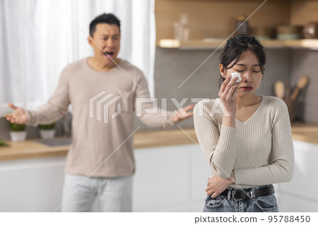 Angry asian husband and wife having fight at kitchen 95788450