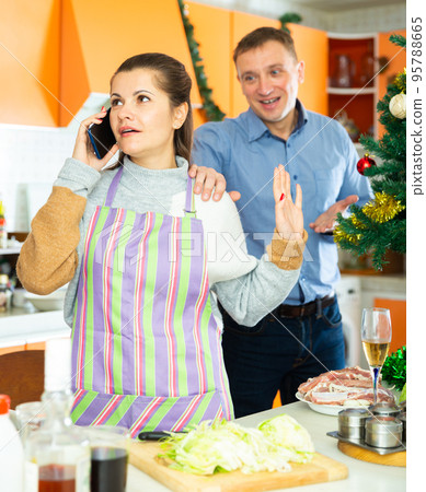 Young woman after quarrel with husband, he trying conversate 95788665