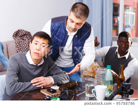 Offended man during quarrel with friends Offended man during quarrel with friends 95788786