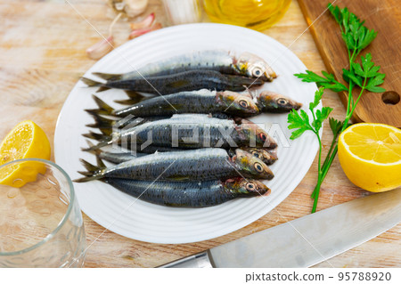 Fresh sardines on plate, fish dish 95788920