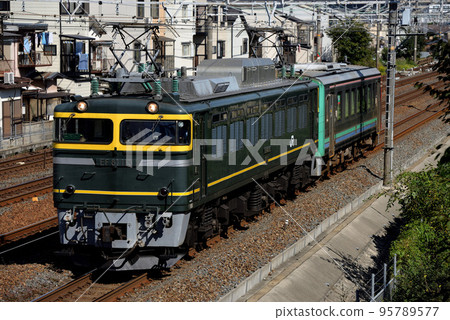 Kiha 120 diesel car forwarding train pulled by EF81113 running on the Tokaido Line Kiha 120 diesel car forwarding train pulled by EF81113 running on the Tokaido Line 95789577