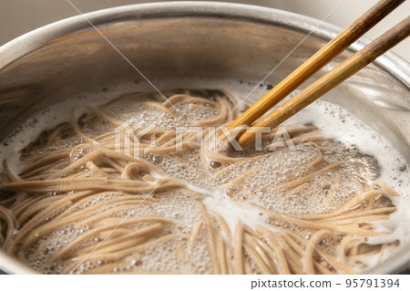 Soba noodles being boiled in a pot Soba noodles being boiled in a pot 95791394
