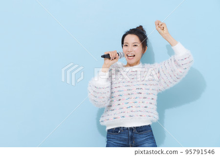woman enjoying singing woman enjoying singing 95791546