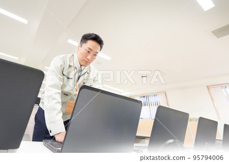 Staff working on PC kitting PC kitting setup business image 95794006