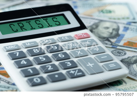 dollar crisis. crisis text on calculator on us dollars background. calculation of price increases, the cost of products and goods. economic crisis caused by high Monetary Inflation 95795507