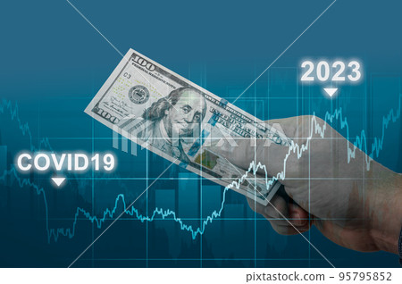 inflation in 2022 and 2023, dollar hyperinflation with dark blue background. one hundred dollars bill in hand of man on against rising inflation chart. US dollar inflation inflation in 2022 and 2023, dollar hyperinflation with dark blue background. one hundred dollars bill in hand of man on against rising inflation chart. US dollar inflation 95795852