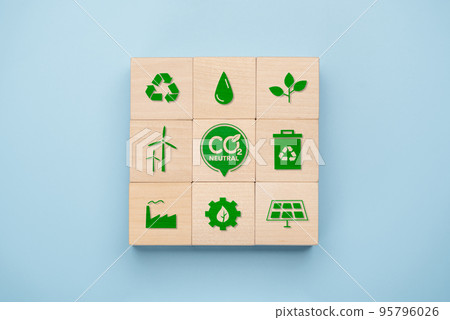 Net Zero and Carbon Neutral Concepts, Net Zero Emissions Goals, Long-Term Climate Neutral Strategies. wooden cube with green net center icon and green icon related to global environment. Net Zero and Carbon Neutral Concepts, Net Zero Emissions Goals, Long-Term Climate Neutral Strategies. wooden cube with green net center icon and green icon related to global environment. 95796026