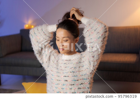 A woman relaxing at home beauty 95796319