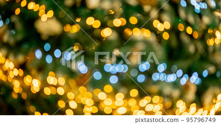 Christmas background bokeh. Christmas tree bokeh light in green yellow golden color, holiday abstract background, blur defocused Christmas background bokeh. Christmas tree bokeh light in green yellow golden color, holiday abstract background, blur defocused 95796749
