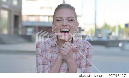 Portrait of Excited Young Woman Screaming Outdoor Portrait of Excited Young Woman Screaming Outdoor 95797427