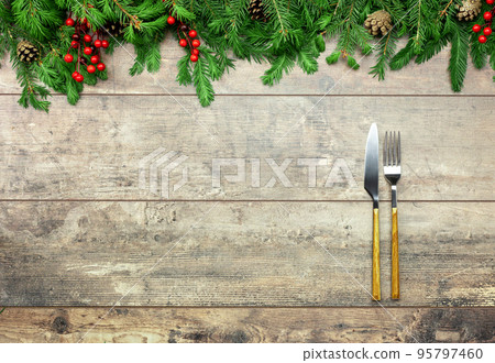 christmas dinner mockup. New Year Christmas dinner concept. Christmas decorations and Cutlery on wooden rustic table. Christmas table place setting. Winter holidays background. Top view, copy space 95797460