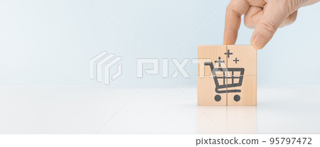 Sale volume increase make business grow concept. businessman's hand hold top cube of sales pyramid. Flips cube with icon graph and shopping cart symbol. banner Sale volume increase make business grow concept. businessman's hand hold top cube of sales pyramid. Flips cube with icon graph and shopping cart symbol. banner 95797472