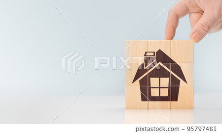 house on wooden cubes. Concept of construction, real estate background. House icon on wooden cube blocks. copy space. advertisement for real estate developer house on wooden cubes. Concept of construction, real estate background. House icon on wooden cube blocks. copy space. advertisement for real estate developer 95797481