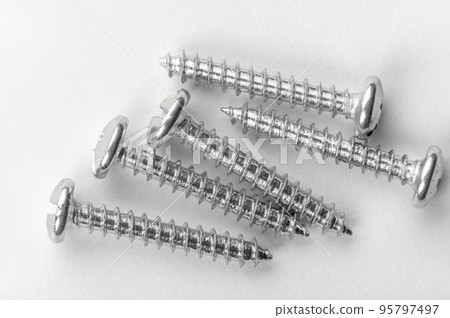 five screws on white paper. detailed macro photo. 5 Metal Screw On White Background. five screws on white paper. detailed macro photo. 5 Metal Screw On White Background. 95797497