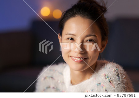 A woman relaxing at home A woman relaxing at home 95797691