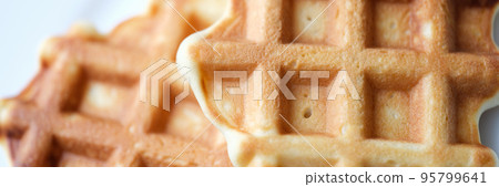Homemade Belgian sugar waffles on plate closeup 95799641