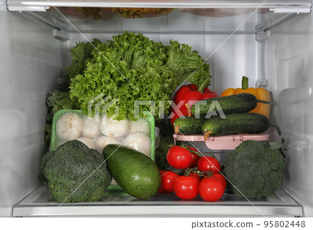 Different fresh products on shelf in refrigerator Different fresh products on shelf in refrigerator 95802448