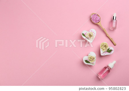 Flat lay composition with natural handmade soap on pink background. Space for text 95802823