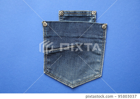 Stylish jeans pockets on blue background, top view Stylish jeans pockets on blue background, top view 95803037