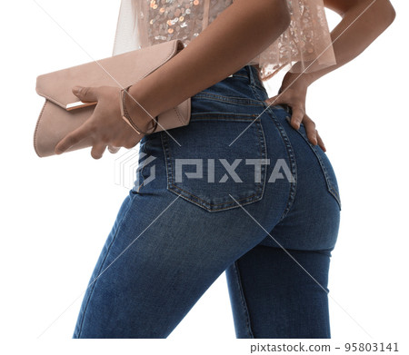 Woman in jeans with clutch purse on white background, closeup 95803141