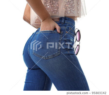 Woman wearing jeans on white background, closeup Woman wearing jeans on white background, closeup 95803142