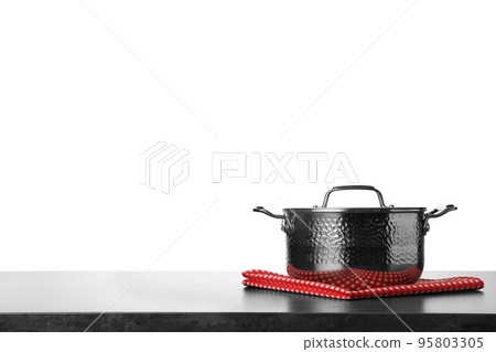 Folded kitchen towel and pot on grey table. Space for design 95803305