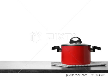 Folded kitchen towel and pot on grey table. Space for design Folded kitchen towel and pot on grey table. Space for design 95803306