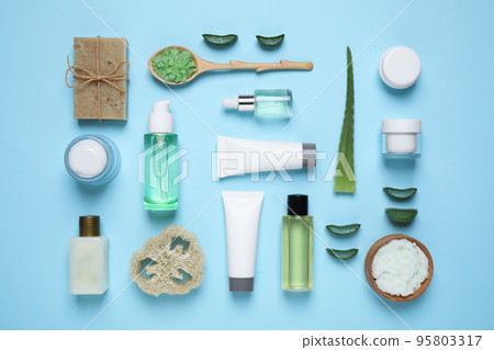 Flat lay composition with aloe vera and cosmetic products on light blue background Flat lay composition with aloe vera and cosmetic products on light blue background 95803317
