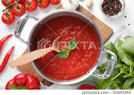 Delicious tomato sauce on white wooden table, flat lay 95803449