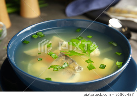 Delicious fish soup in bowl on table, closeup view 95803487