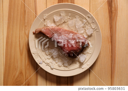 Piece of fresh raw fish with ice on wooden table, top view Piece of fresh raw fish with ice on wooden table, top view 95803631