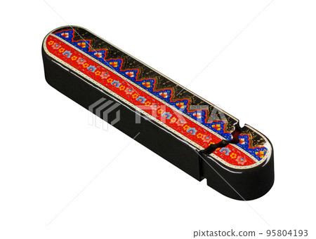 A closeup of a pencil case with artistic painting on a white background. Central Asia, Uzbekistan 95804193