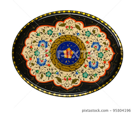 A closeup of a round casket with an artistic painting on a white background. Central Asia, Uzbekistan A closeup of a round casket with an artistic painting on a white background. Central Asia, Uzbekistan 95804196