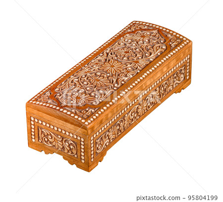 A wooden casket with traditional artistic carving isolated on a white background A wooden casket with traditional artistic carving isolated on a white background 95804199