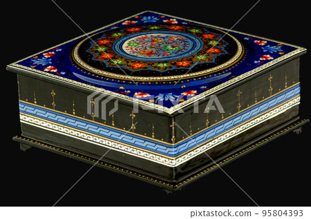 A closeup of a casket with an artistic painting on a black background. Central Asia, Uzbekistan 95804393