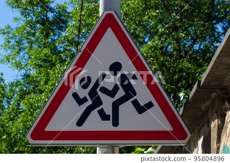 Road sign Children, against a tree in a shadow Road sign Children, against a tree in a shadow 95804896
